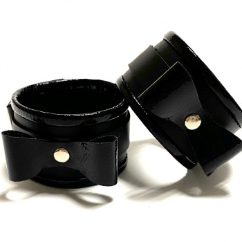 Наручники с бантиками из эко-кожи черные 50007ars