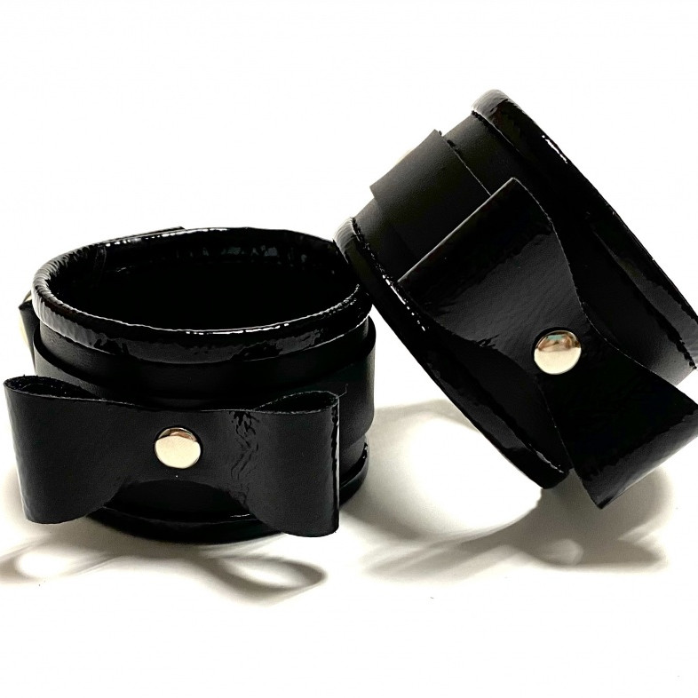 Наручники с бантиками из эко-кожи черные 50007ars